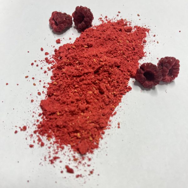 Dried raspberries and a powdered version displayed on a white background.